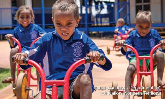 Aboriginal school children riding bikes